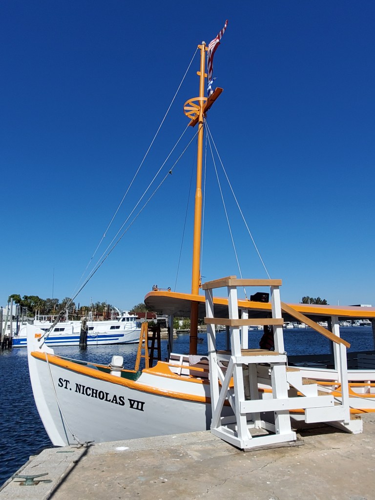 Tarpon Springs Sponge Docks St Nicholas Boat Lines traditional boat in the water