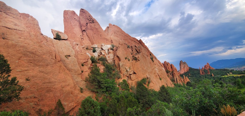 Colorado Road Trip Garden of the Gods Colorado Springs Large red rocks jetting out into blue skys