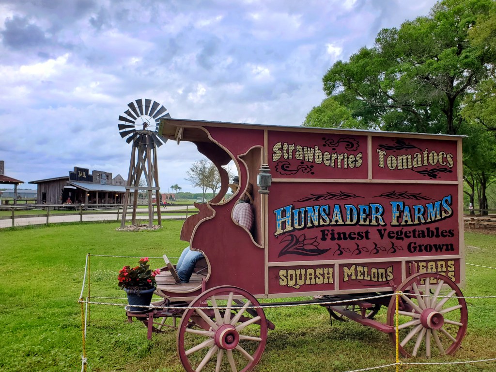 Stage coach with stuffed scarecrow with Hunsader Farms on the side
