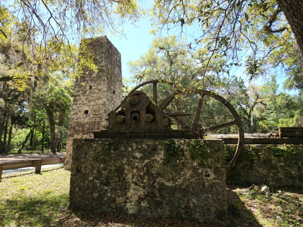 Yulee Sugar Mill Ruins Historic State Park large stone chimney with large metal gears 